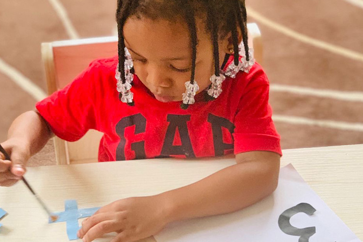 child learning online in a pre-school